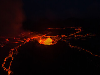 Beautiful aerial cinematic footage of the bowling lava exploding from the Active Volcano in Iceland