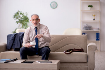 Old businessman employee waiting for business meeting