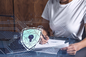 A businesswoman in casual wear signing the contract to prevent probability of risks in cyber...