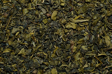 Close up view of green tea leaves, background