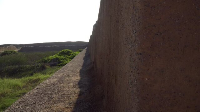 The Ancient Archeological Site of Chan Chan Capital in Trujillo, La Libertad, Peru. Sliding Pan Reveal Landscape Outside Site.