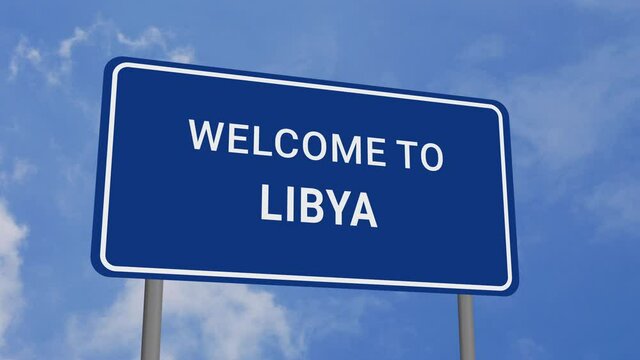 Welcome to Libya Road Sign on Clear Blue Sky with Rapid Moving Clouds
