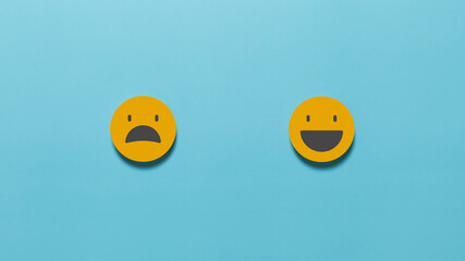 Happy face smile and face sad on blue background. Service rating, satisfaction concept