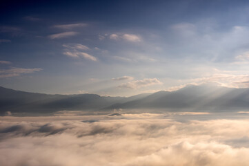 Fototapeta premium Aerial view Beautiful of morning scenery sea of cloud and the fog flows on high mountains.