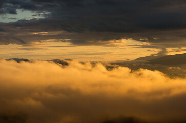Aerial view Beautiful of morning scenery Golden light sunrise And the mist flows on high mountains and forest , Wonder fog.