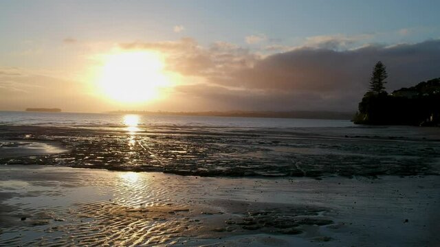 Drone Footage of a sunrise over Howick beach in east Auckland.