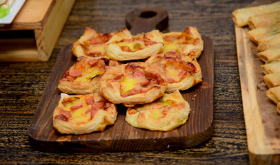freshly baked croissants on grey wooden table