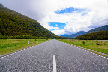 Road to Mount Cook Peak mountain New Zealand with blue sky.
