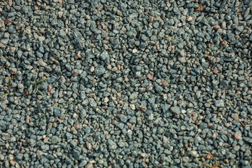 Background, small stones of gray color on a ground. High quality photo