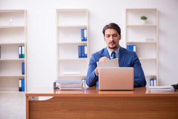 Young businessman employee working in the office