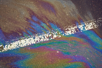 Picture of an oil spill on asphalt in a car park