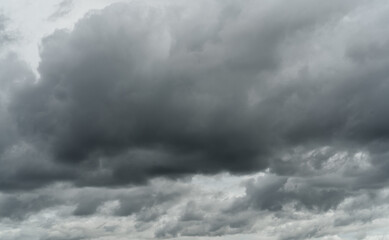 Overcast sky. Dramatic gray sky and white clouds before rain in rainy season. Cloudy and moody sky. Storm sky. Cloudscape. Gloomy and moody background. Overcast clouds. Halloween day background.