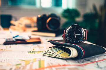 watch, money wallet, passport, airplane model, camera on road map. Object for travel concept.