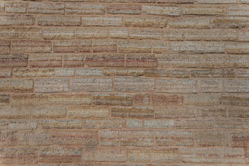 Wall surface with sanded masonry.