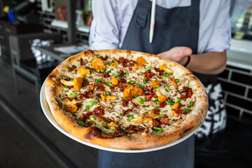 tasty pizza with chanterelles and vegetables