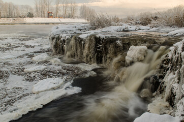 Venta waterfall, the widest waterfall in Europe, long exposure photo in winter day, Kuldiga, Latvia.