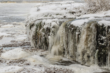 Venta waterfall, the widest waterfall in Europe, long exposure photo in winter day, Kuldiga, Latvia.