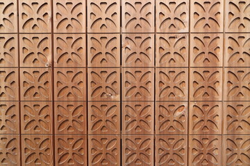 a wooden wall with a gingerbread pattern 
