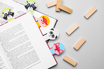 Cute bookmarks with books on grey background