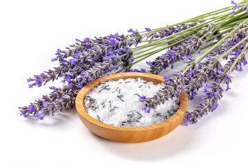 Lavender sea salt with a bunch of lavandula flowers, aromatic herb for cooking or a bath salt for spa, on a white background