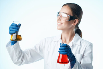 Fototapeta premium female laboratory assistant chemical solution research science analyzes