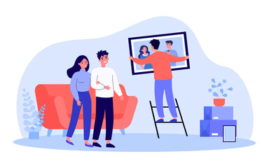 Young man hanging family portrait on wall. Flat vector illustration. Couple watching man helping by hanging framed photograph on wall in living room. Family, photography, service, decoration concept