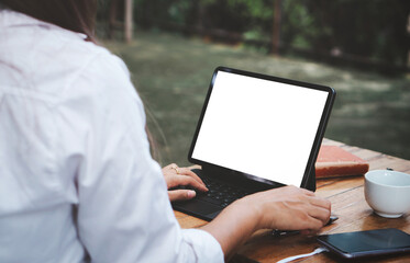 Young female student learning online class with teacher, Blank white screen of tablet for display your product or product montage.