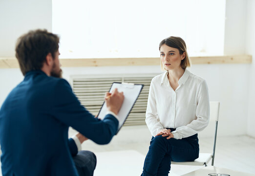 male psychologist communicates with a woman patient consultation lifestyle