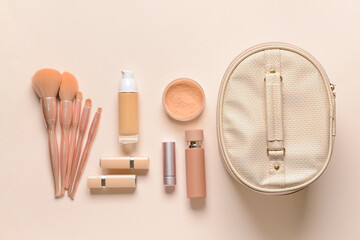 Stylish bag and decorative cosmetics on color background