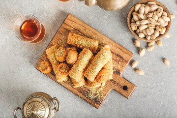 Composition with delicious baklava on grey background