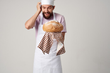 bearded chef with bread in the hands of gourmet professionals work