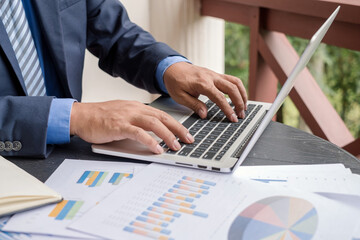 work from home, The hand of the businessman who works in finance at home and calculates financial...