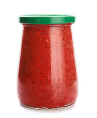 Jar of tasty pesto sauce on white background