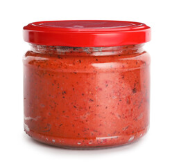 Jar of tasty pesto sauce on white background