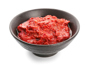 Bowl of tasty pesto sauce on white background