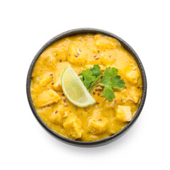 Bowl of tasty chicken curry on white background