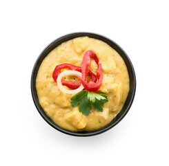 Bowl of tasty chicken curry on white background