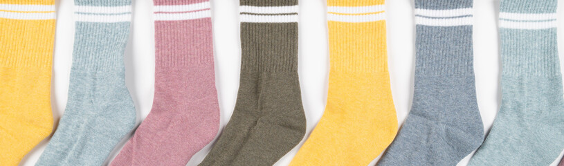 Close up of colorful socks isolated on white, cropped view