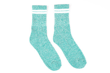 Pair of warm turquoise socks isolated on white, top view