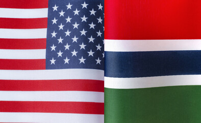 fragments of the national flags of the United States and  Republic of the Gambia in close-up