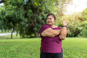 Fat woman asian exercise outdoors for weight loss idea concept.