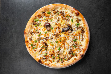 pizza with mushrooms on the black background