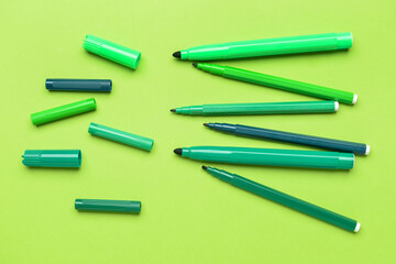 Colorful markers on color background