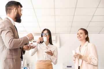 Business people having coffee break in office