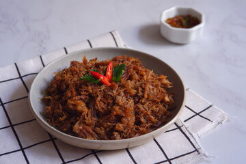 a plate of fried shredded beef  