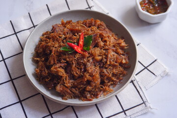 a plate of fried shredded beef  