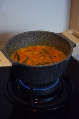 cooking vegetable soup in a casserole 