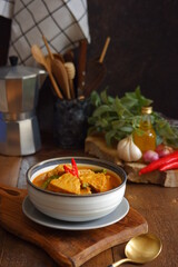 a bowl of spicy vegetable soup on the table 