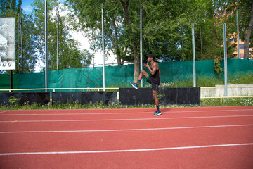 young african american man training on running track