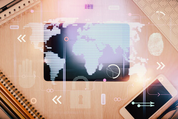 Double exposure of map hologram drawing over desktop. Top view. International connection concept.